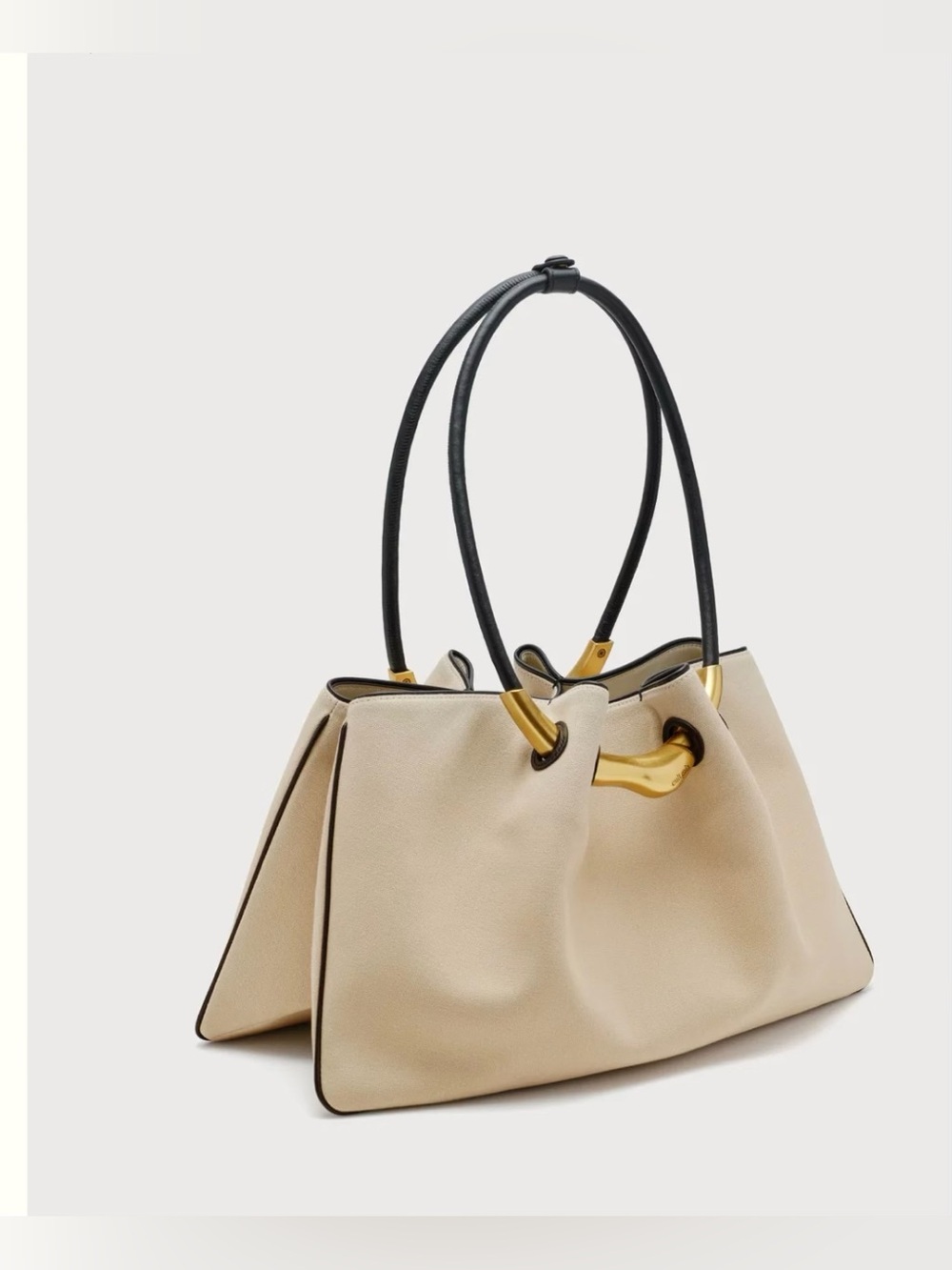 Cult Gaia beige “Asa Satchel” with black handles. 
Retail value is $598.
